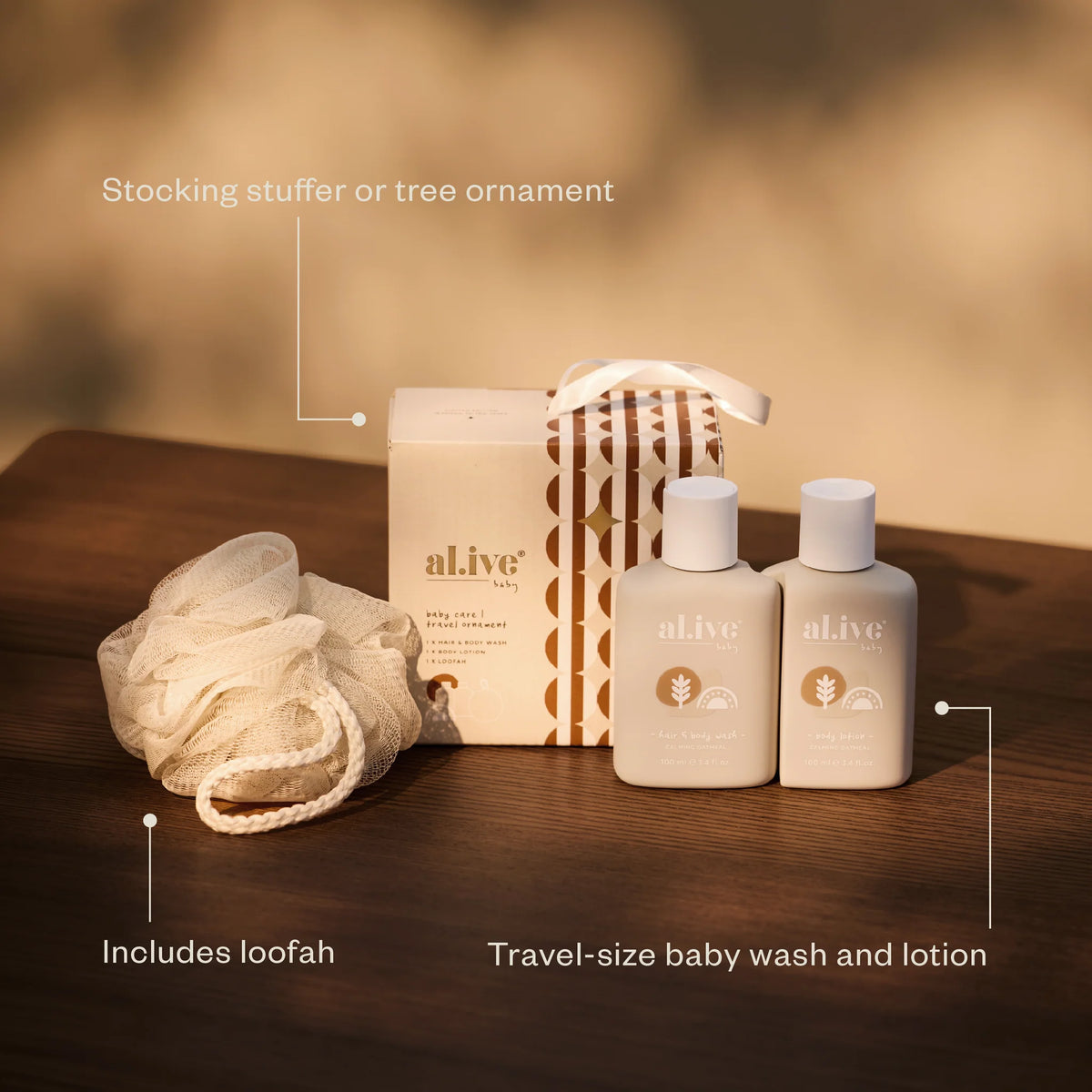 al.ive body Baby Care Travel Ornament with travel-size baby wash, lotion and loofah, a stocking stuffer or tree ornament