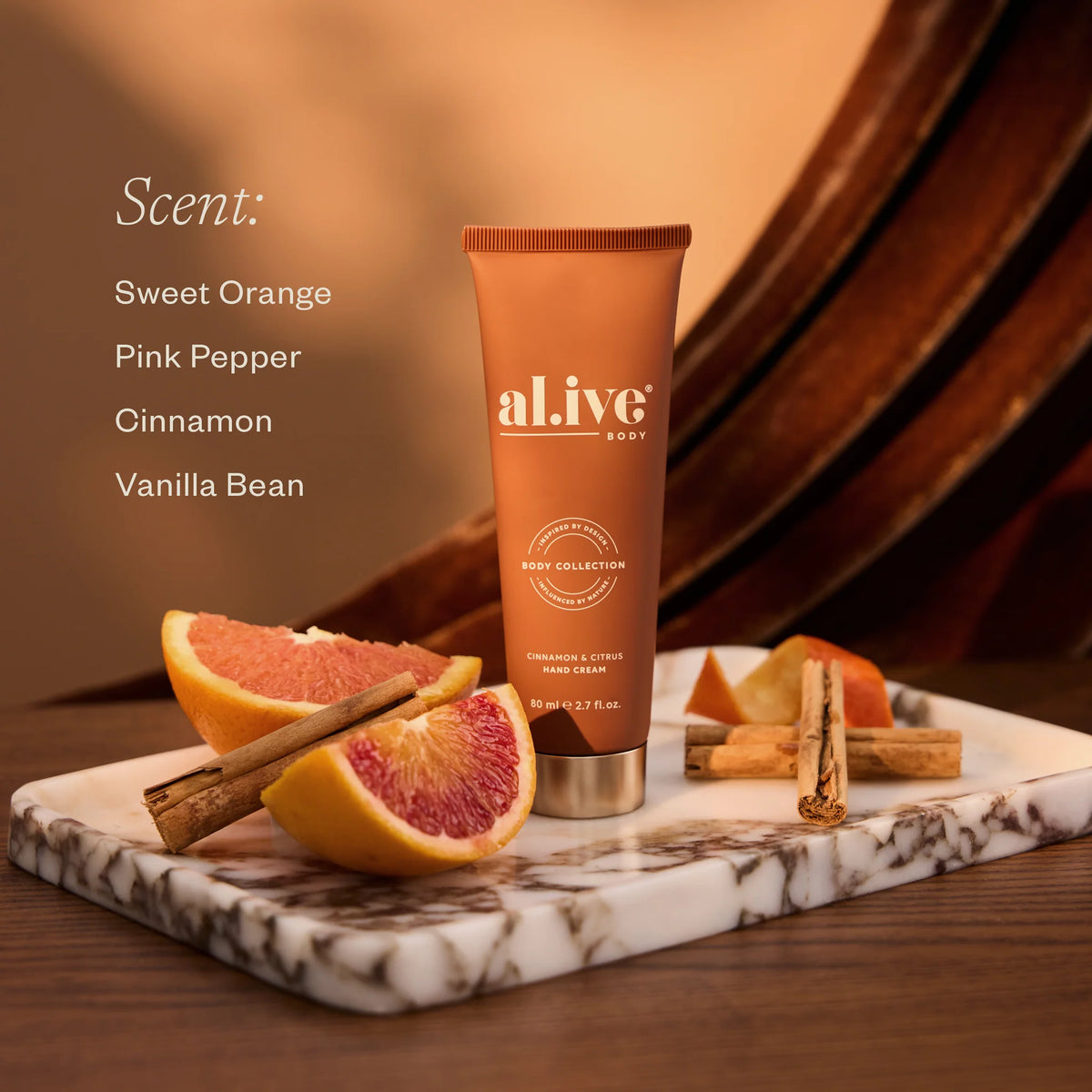 al.ive body Cinnamon & Citrus Hand Cream with scent notes of sweet orange, pink pepper, cinnamon and vanilla bean