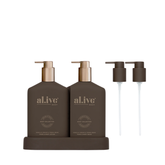 al.ive body Limited Edition Transformative Wash & Lotion Duo in Vanilla Cream & Tonka Bean, Chocolate bottles on matching tray with bronze pumps