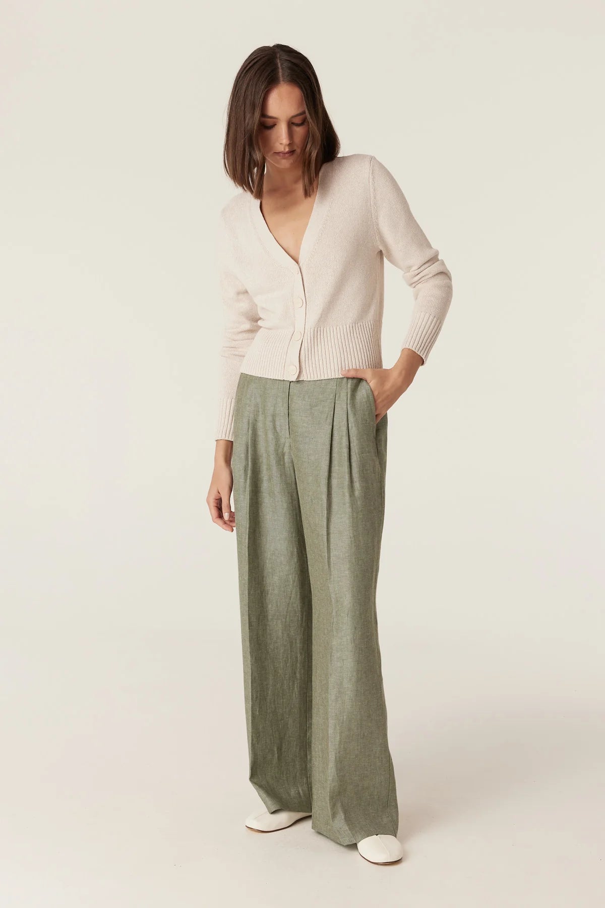 Cable Melbourne Evelyn Linen Pant in Green, styled with a cream cardigan (cardigan not included) - additional front view