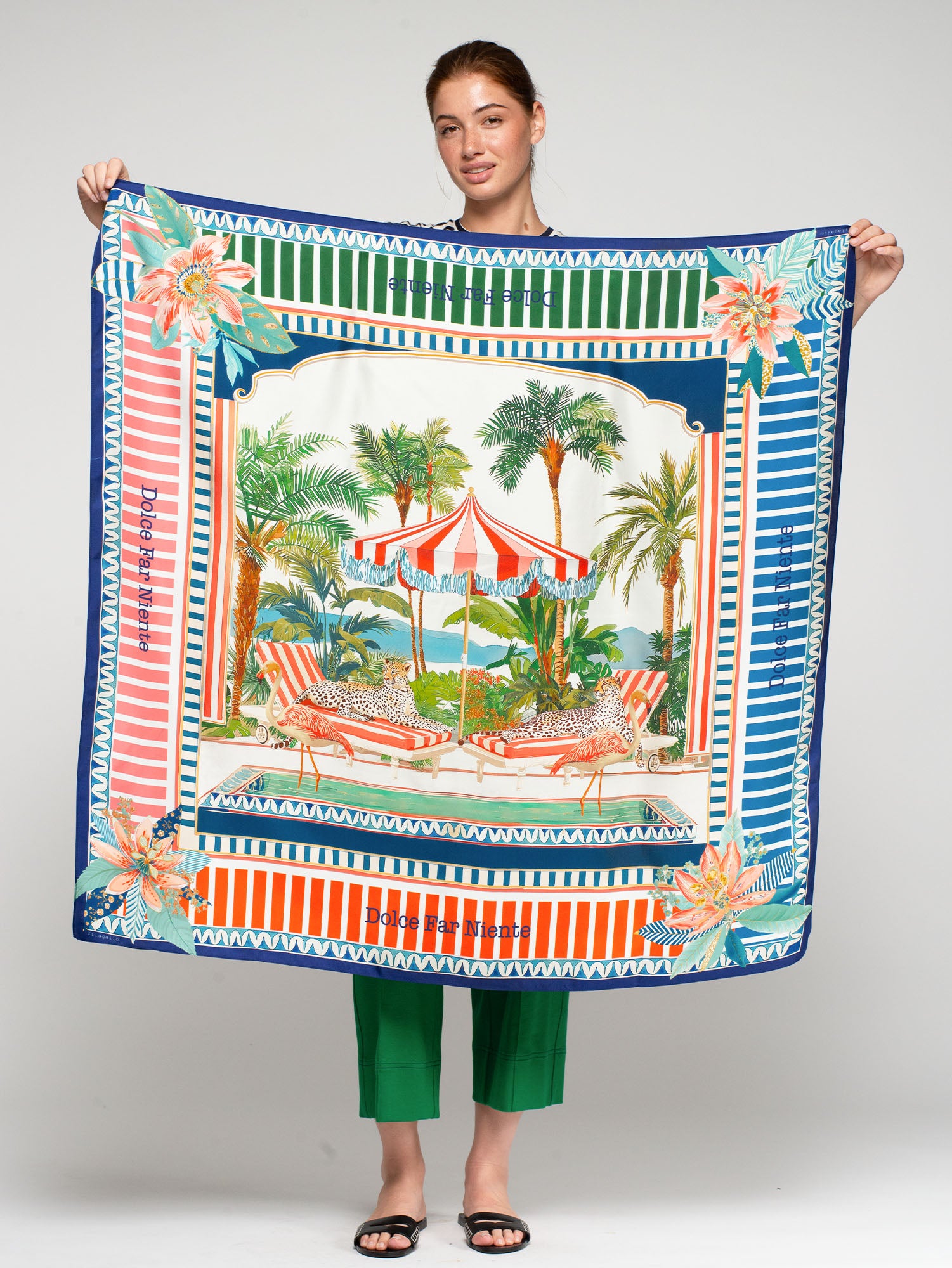 Vilagallo Farniente Silk Scarf held by model, Dolce Far Niente poolside cheetah and flamingo print