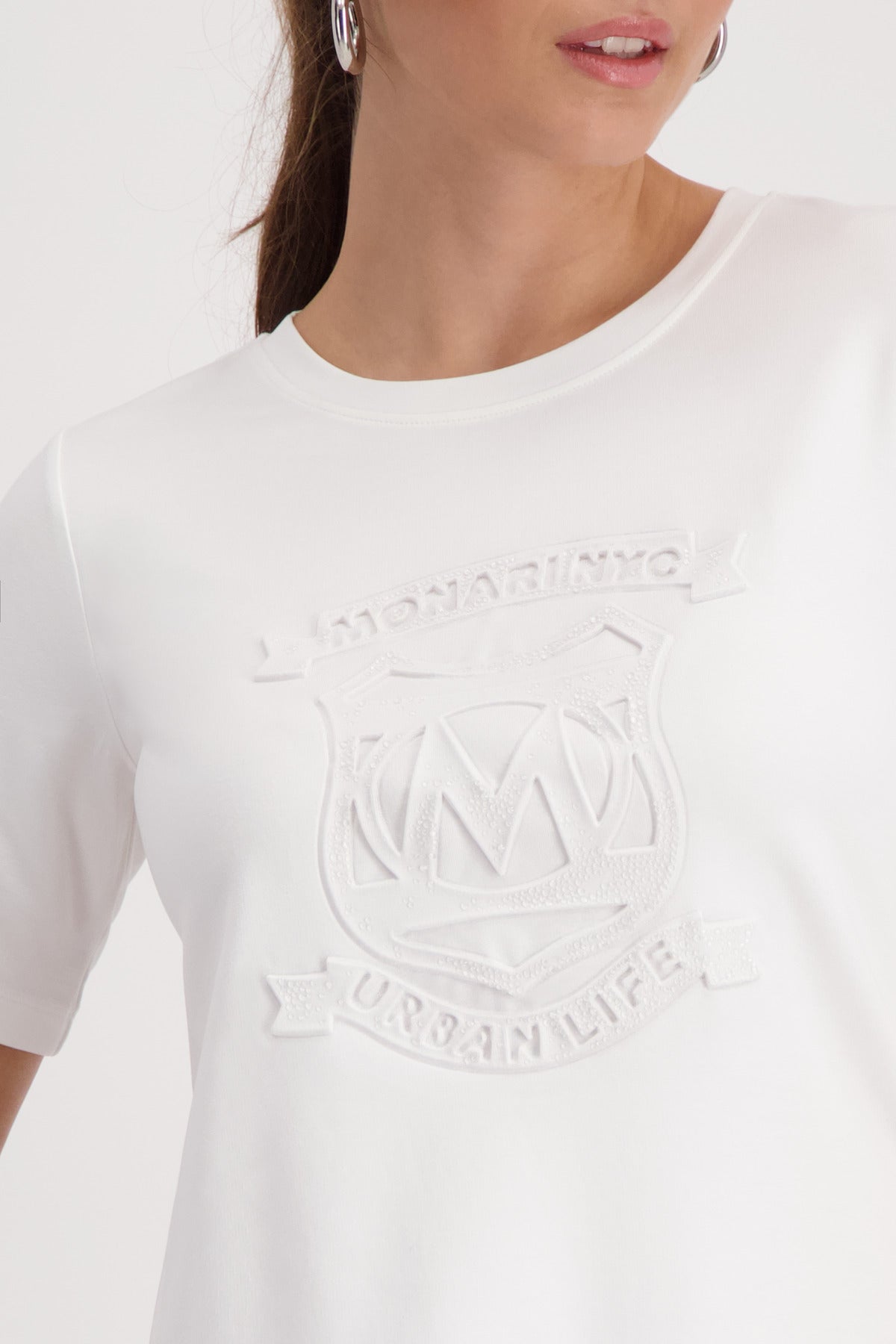 Monari Basic Emblem T-Shirt in Off-White - close-up detail, worn