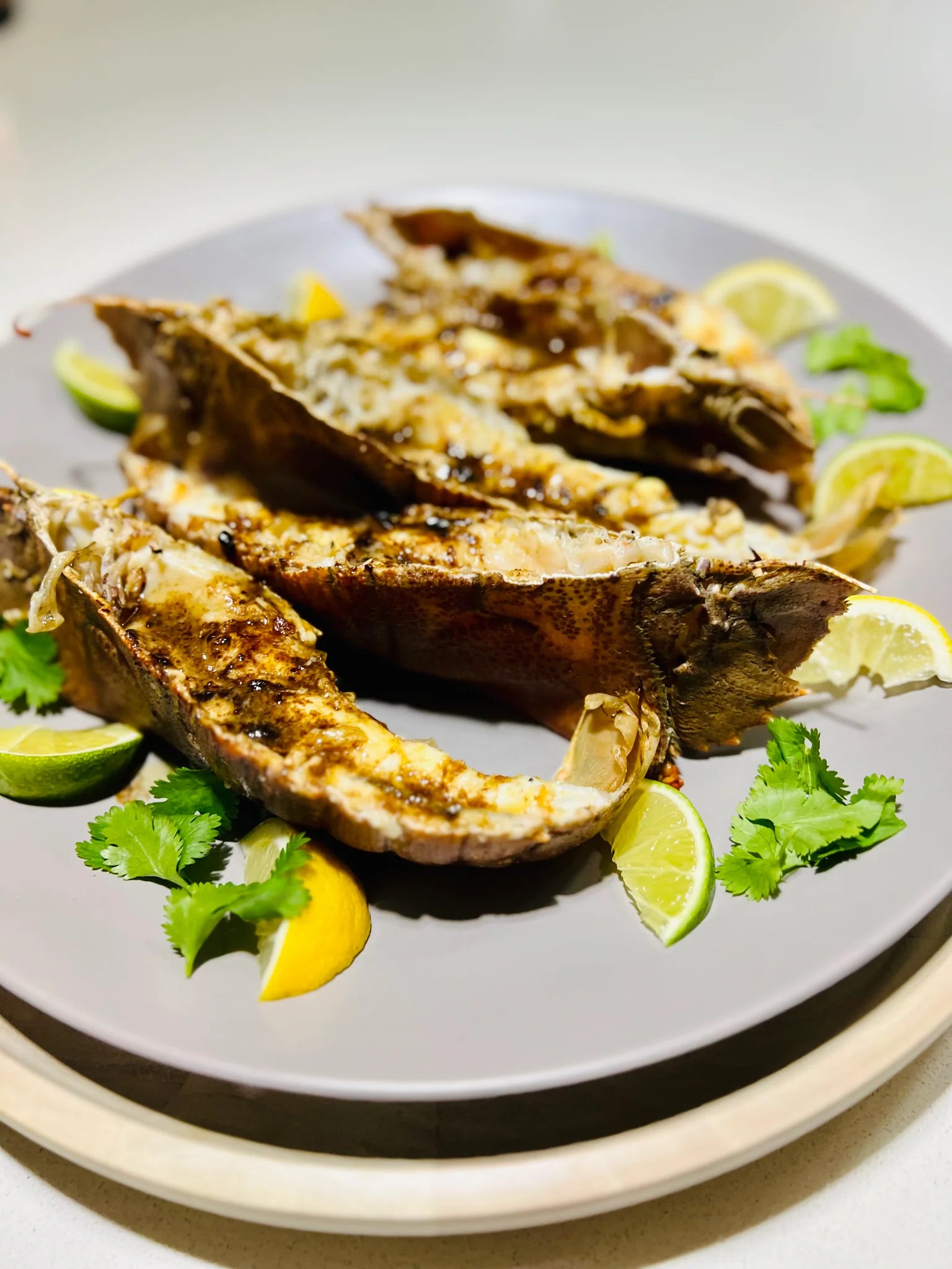 Grilled seafood with lime and coriander, dressed with Noosa Black Garlic