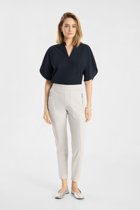 Model wearing Raffaello Rossi Corry Hightech Jersey Pant in Chalk with a navy top