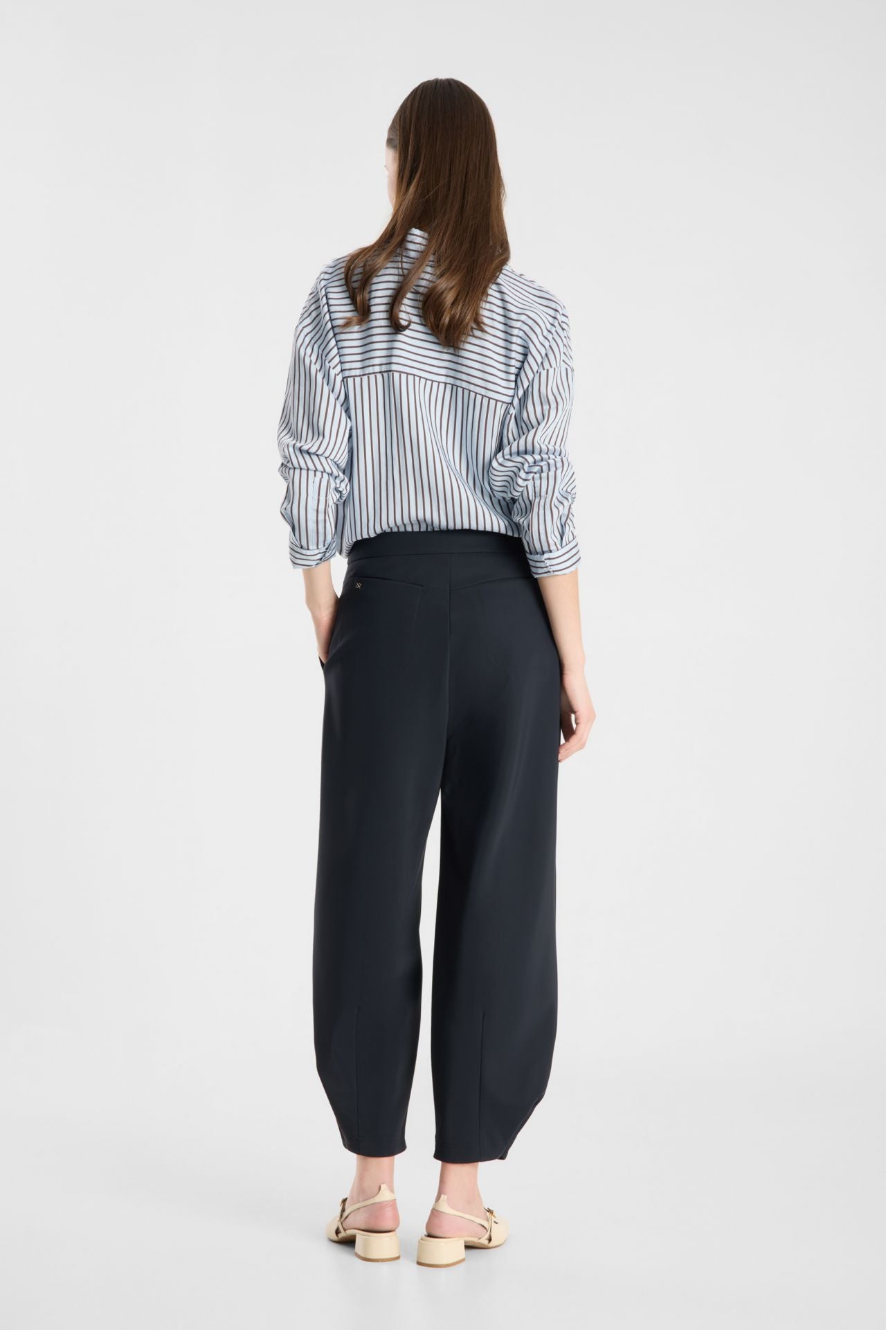 Model wearing Raffaello Rossi Odine Jersey Pant in Navy, back view showing the barrel leg
