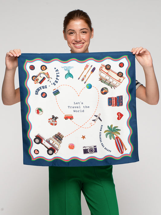 Vilagallo Surf Print Medium Silk Scarf held by model, 60 x 60 cm travel and surf themed silk scarf