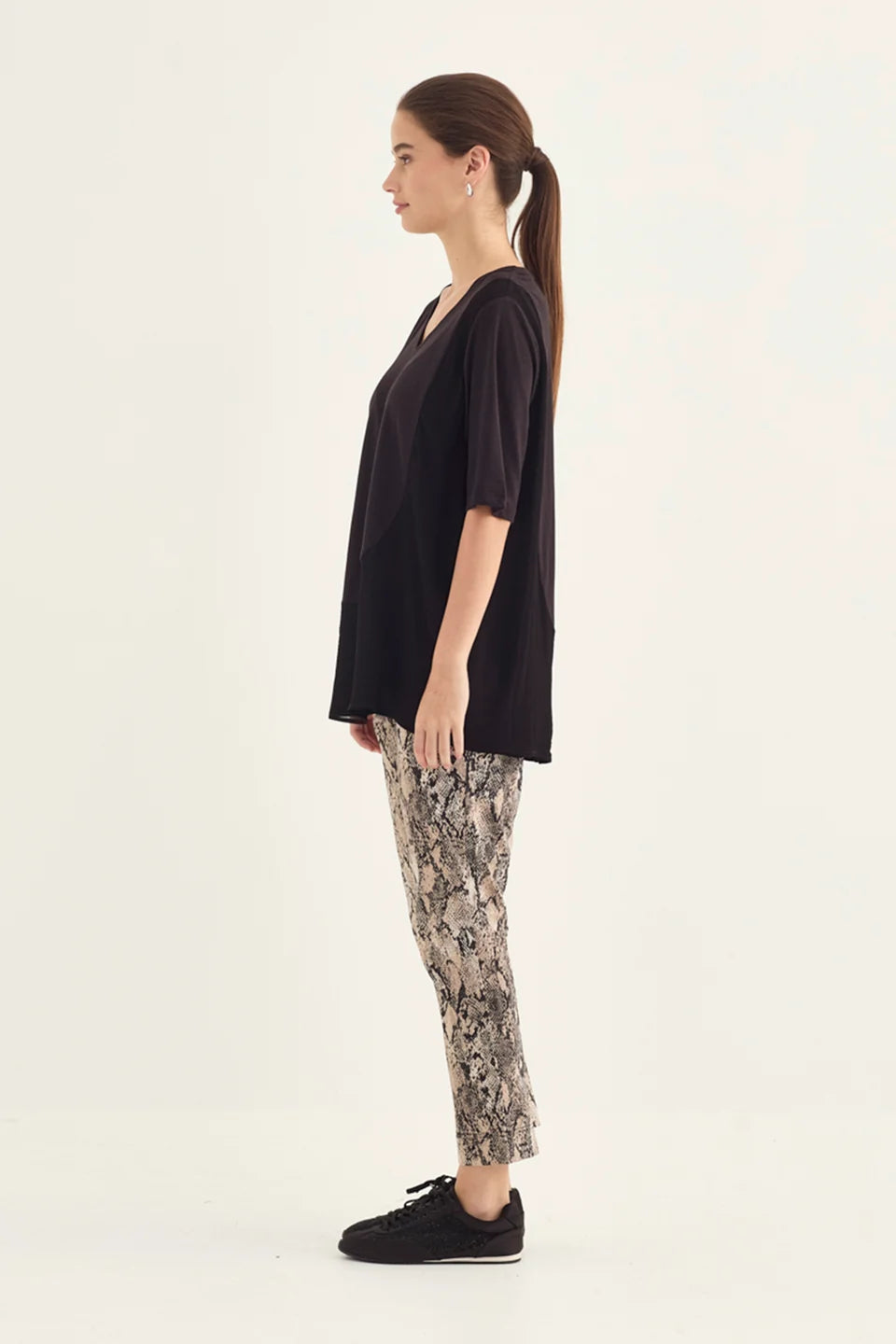 Verge Acrobat Serpent 7/8 Pant in Serpent Print, worn - side